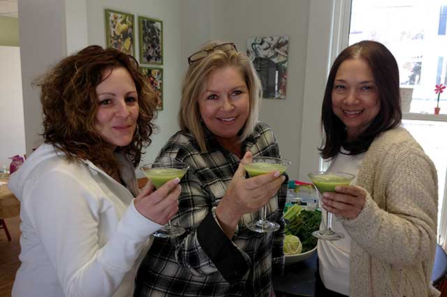 three women with smoothies at The Organic Teaching Kitchen